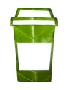 The glass water straw made from paper cutting on leaf green background. Biodegradable package concept