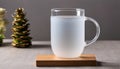 A glass of water on a wooden coaster