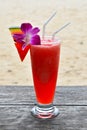 Glass of watermelon fresh juice on beach Royalty Free Stock Photo