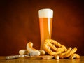 Glass Wheat Beer with Grilled Sausage and Prezel Royalty Free Stock Photo