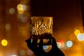 Glass of whiskey against the backdrop of the city Royalty Free Stock Photo