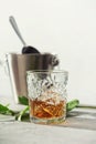 Glass of whiskey with ice cubes and ice bucket close up Royalty Free Stock Photo