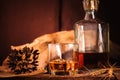 Glass of whiskey with ice decanter on wooden table Royalty Free Stock Photo