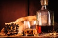 Glass of whiskey with ice decanter on wooden table Royalty Free Stock Photo