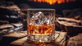 Glass of whiskey on an old wooden table. Alcohol drink, splash, ice cube Royalty Free Stock Photo