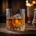 Glass of Whiskey with Ice and a Bottle of Whiskey on a Wooden Table Royalty Free Stock Photo