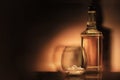 A glass of whiskey scotch bourbon with ice and a vintage-style bottle on a dark black and gold background in the style