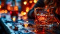 a glass of whiskey stands elegantly on a wooden table Royalty Free Stock Photo