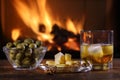 A glass of whisky and plate with cheese, olives and nuts Royalty Free Stock Photo