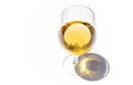 glass of white wine on white background with sparkling shadows. Free copy space. Concept of luxury drinks. Top view