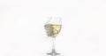 Glass of White Wine Breaking and Splashing against White Background Royalty Free Stock Photo