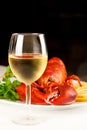 Glass of white wine with cooked lobster Royalty Free Stock Photo