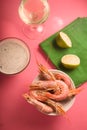 Glass with white wine, lime on a green napkin, shrimp in a bowl Royalty Free Stock Photo