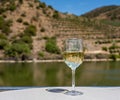 Glass of white wine on a cruise boat on Douro river in Portugal Royalty Free Stock Photo