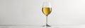 Glass of white wine on a white background with copy space Royalty Free Stock Photo