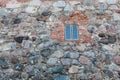 Glass window in old castle wall Royalty Free Stock Photo