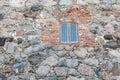 Glass window in old castle wall Royalty Free Stock Photo