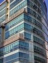 Glass Windows of City Building Reflected by Sun and Shadow Royalty Free Stock Photo