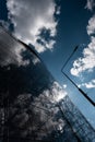 glass windows of modern skyscraper office building, contemporary futuristic exterior on sky background Royalty Free Stock Photo