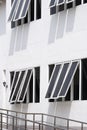 Glass windows with stainless steel sidewalk railing outside of modern building Royalty Free Stock Photo