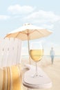 Glass of wine on adirondack chair at the beach Royalty Free Stock Photo