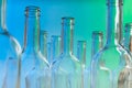 Glass wine bottlenecks on blue background Royalty Free Stock Photo