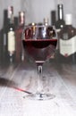 Glass of wine, brandy or cognac on the mirror wooden table Royalty Free Stock Photo