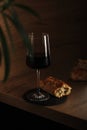 A glass of wine with bread in minimalistic style