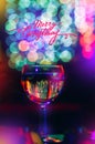A glass of wine, champagne on a background of bright multi-colored bokeh. The concept of a solemn feast, congratulations Royalty Free Stock Photo