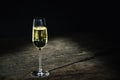 a glass of wine or champagne on a vintage wooden table background Royalty Free Stock Photo