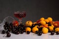 Glass of wine, cherries, apricots and peaches Royalty Free Stock Photo