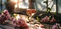 a glass of wine in front of a flower vase Royalty Free Stock Photo