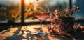 a glass of wine in front of a flower vase Royalty Free Stock Photo