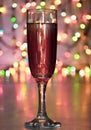 Glass of wine on garland christmas background Royalty Free Stock Photo