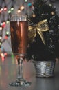 Glass of wine on garland christmas background Royalty Free Stock Photo