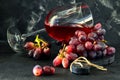 Glass of wine with grapes on a black wooden stand Royalty Free Stock Photo