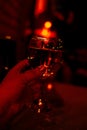 Glass of wine in red light, blurred. Party,joy Royalty Free Stock Photo