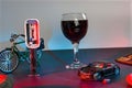A glass of wine near toy wrecked auto, space for text. Dangerous drinking and driving Royalty Free Stock Photo