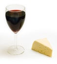 Glass of wine and piece of cheese