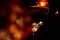 Glass of wine in red light, blurred. Party, joy Royalty Free Stock Photo