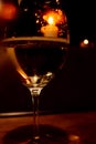 Glass of wine in red light, blurred. Party, joy Royalty Free Stock Photo