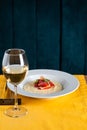 Glass of wine and risotto with strawberries in the restaurant Royalty Free Stock Photo