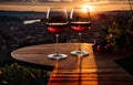 glass of wine on a rustic table, set against a beautiful rural backdrop.