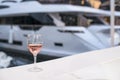 Glass of wine and a yacht Royalty Free Stock Photo