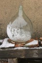Glass wines carboy covered by snow Royalty Free Stock Photo