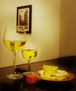 A glass of wonderful white wine with a slice of cheese. Royalty Free Stock Photo