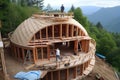 A glass and wood dome house under construction, with scaffolding and workers visible. Generative AI Royalty Free Stock Photo