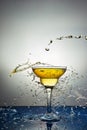 Glass with yellow champagne or cocktail. Levitation Royalty Free Stock Photo