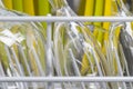 Glass yellow and green plates, background of clean kitchen utensils