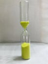 Yellow Sand Watch In A Glass Royalty Free Stock Photo